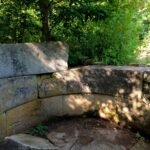 Side view of Dolmen Hidden Abilities with stone surroundings