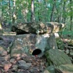 Dolmen Pshada front view in forest surroundings